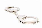 Metal handcuffs isolated on the white background