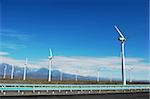 Wind turbine generators in sinkiang,china,with blue skies and white clouds as backgrounds