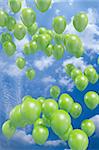 Green balloons flying in the air
