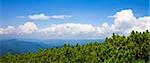 Mountains landscape with clouds and blue sky