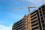 crane building construction with blue sky background