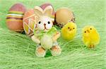 Easter bunny and chicks, Painted brownl Easter Eggs on green Grass