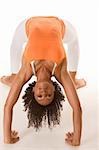 Fitness series - Dark skinned fit woman holding bridge stretching pose