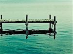 An old jetty at Starnberg Lake in Germany in an artistic color mood