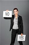 Business young woman trying to make a decision between Yes or No choice