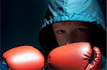 The little boy - boxer in a sport suit. Dark blue.