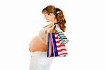 Pregnant woman holding shopping bags in hand isolated on white