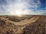 Coast of Southern Morocco with the Atlantic Ocean and a few bungalows with the desert all around