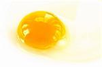 yolk from broken eggs photographed on a light background