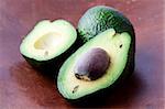 Close-up of avocados on a wooden background