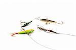 Four Fishing baits on a white background