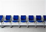 Blue chairs in ordinary empty waiting room