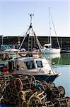 Image of a fishing boat at the harbour after unloading his catch