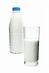 Plastic bottle and glass filled with milk isolated on white