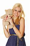 Young attractive woman holding in the arms of Teddy.  Isolated on white