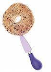 Bagel on a Small Knife Isolated on White with a Clipping Path.