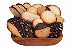 Biscuit dough with chocolate in a wooden bowl.