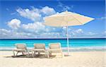 Caribbean beach parasol white umbrella and hammocks turquoise sea