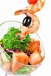 Fried kebab of shrimps with vegetables, greens and salmon fish