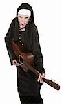 Funny nun sings a song while playing her guitar