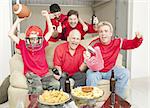 Family of football fans cheering for their favorite team.