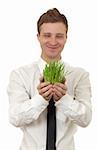 man holding a small plant in the studio isolated