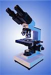 Laboratory metal microscope over blue background