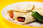 A close up of mexican beef fajitas over yellow background