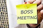 Boss meeting post it in business man hand