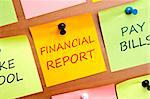 Financial report post it on wooden wall