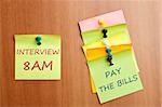 Interview reminder post it on wooden wall