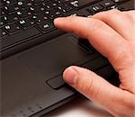 Using a laptop, finger on touchpad