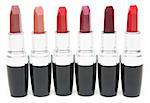 Lipstick stands in row on white background