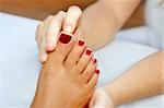 Reflexology woman feet massage therapy outdoor