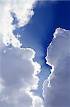 beams from sun in blue sky gray clouds skyscape background