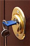 Keys and secure lock in steel door of new apartment