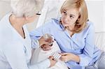 Mom holds out her daughter pills and a glass of water