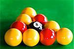 Close-up of billiard balls dispsed in triangle on a pool