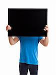 Portrait of a young man showing an empty black billboard on white background