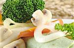 Mushroom, broccoli, pepper and onion on green colored pancake (Selective Focus, Focus on mushroom slice and broccoli)