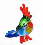 Colorfull glass statuette of a parrot on white background