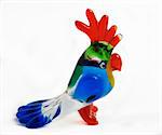 Colorfull glass statuette of a parrot isolated