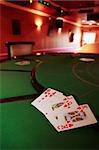 green casino table with a hand of a royal flush in a poker game