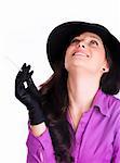 Portrait of a beautiful brunette young woman with black hat, gloves and cigar