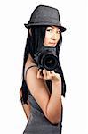 A young asian girl getting ready to take a photo with an SLR camera.