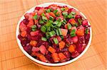 Vinaigrette Russian salad of beetroot, carrot, potato, green leek and olive oil