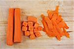Chopped carrot for cooking on the rustic wooden board