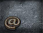 rusty email symbol on grunge background - 3d illustration