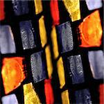 Colorful stained glass abstract illuminated squares. Selective focus.