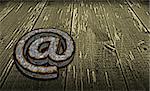 rusty email symbol on grunge wooden background - 3d illustration